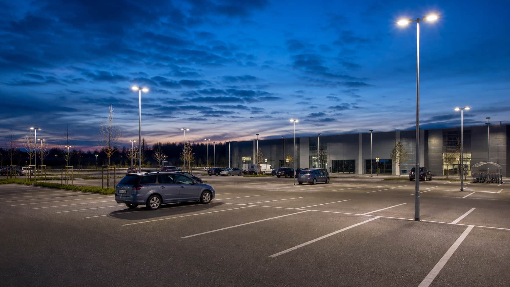 LED area lighting lens for parking lot lighting