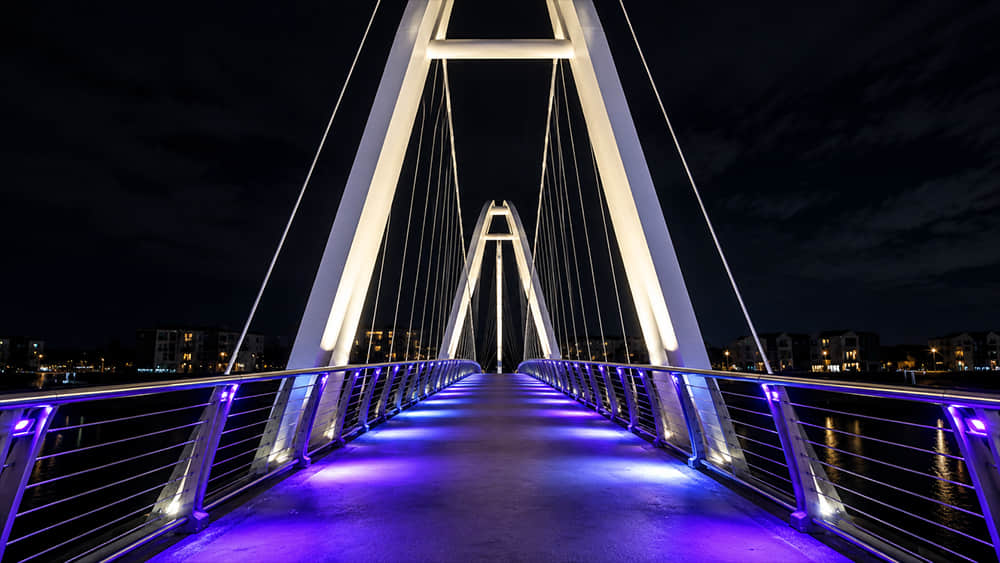 Modern Pedestrian Bridge LED Lighting Design with Blue and Purple Illumination